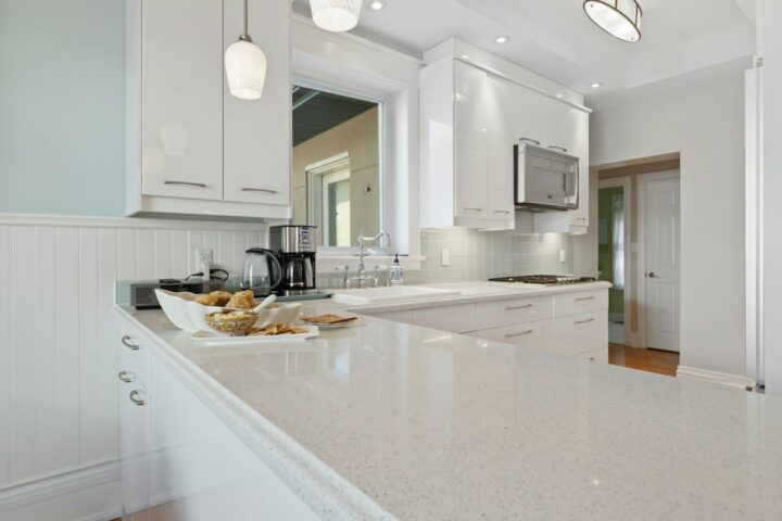 Bright kitchen with white marble-look worktops, the kind of finish many DIYers recreate with epoxy countertops