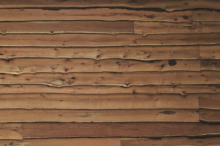 Close-up of a sawn wooden board showing grain and growth rings, the kind of detail to inspect when choosing live edge slabs