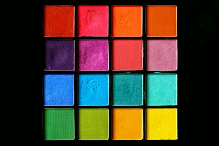 Rainbow of shimmering pressed pigments showing the range of mica powder colours used to tint resin