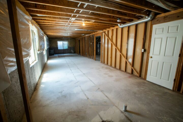Open basement with bare concrete slab ready for an epoxy basement floor coating