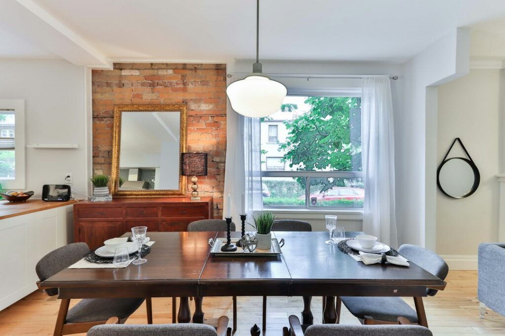 Solid wood dining table with chairs in a dining room, the setting for a resin dining table in a UK home