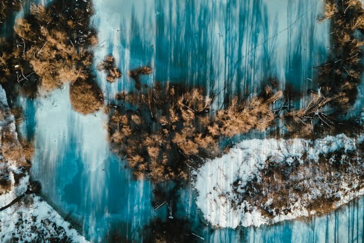 Flowing blue and brown pattern resembling the resin river and timber of river tables for sale