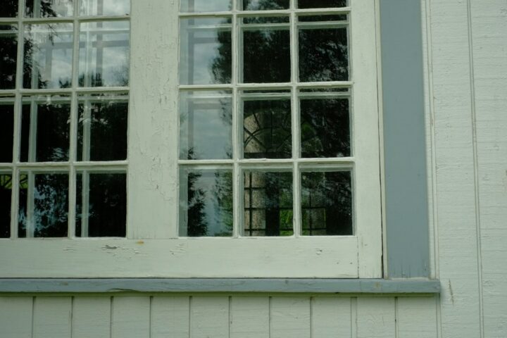 Rotten window sill corner being rebuilt with wood rot repair epoxy filler