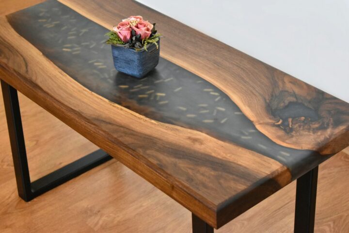 Live edge wood dining table showing the natural edge of the slab