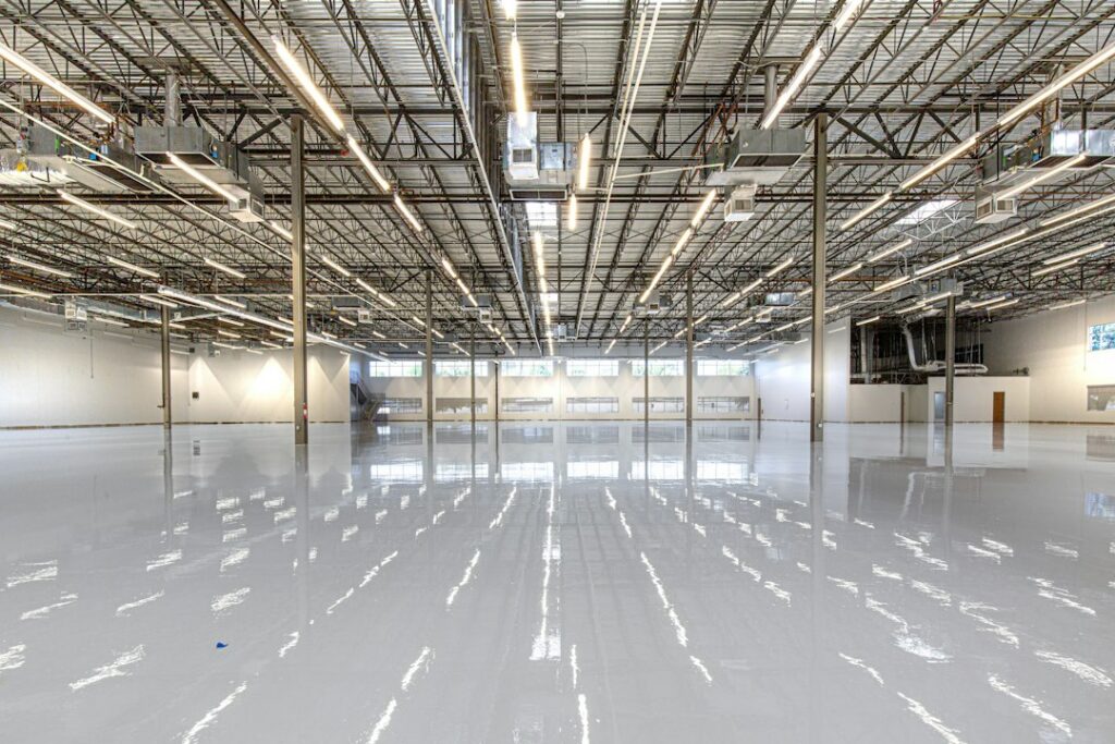 Glossy metallic epoxy floor with silver and copper swirl pattern