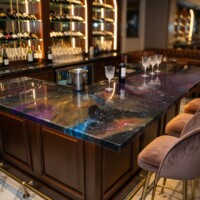 Nebula Luminary resin bar counter glowing at night