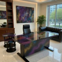 Nebula Luminary office desk with a glowing resin top